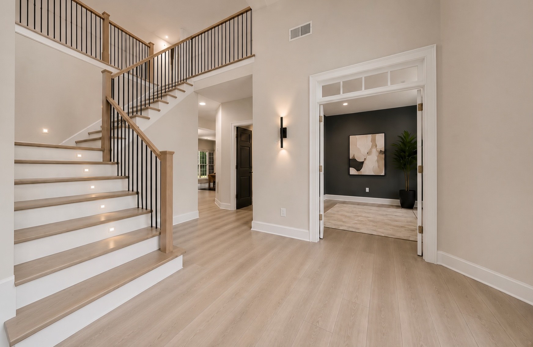 Foyer with oak stair and finished rooms